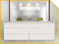 Modern reception area with a white two-drawer desk, gray textured wall, the word RECEPTION in back, and two yellow chairs behind the desk.