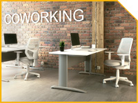 PORTADATONO2200X150 | OfficeDeco Bright coworking space with an exposed brick wall, three white desks, and white chairs; the word 'COWORKING' is visible on the wall.