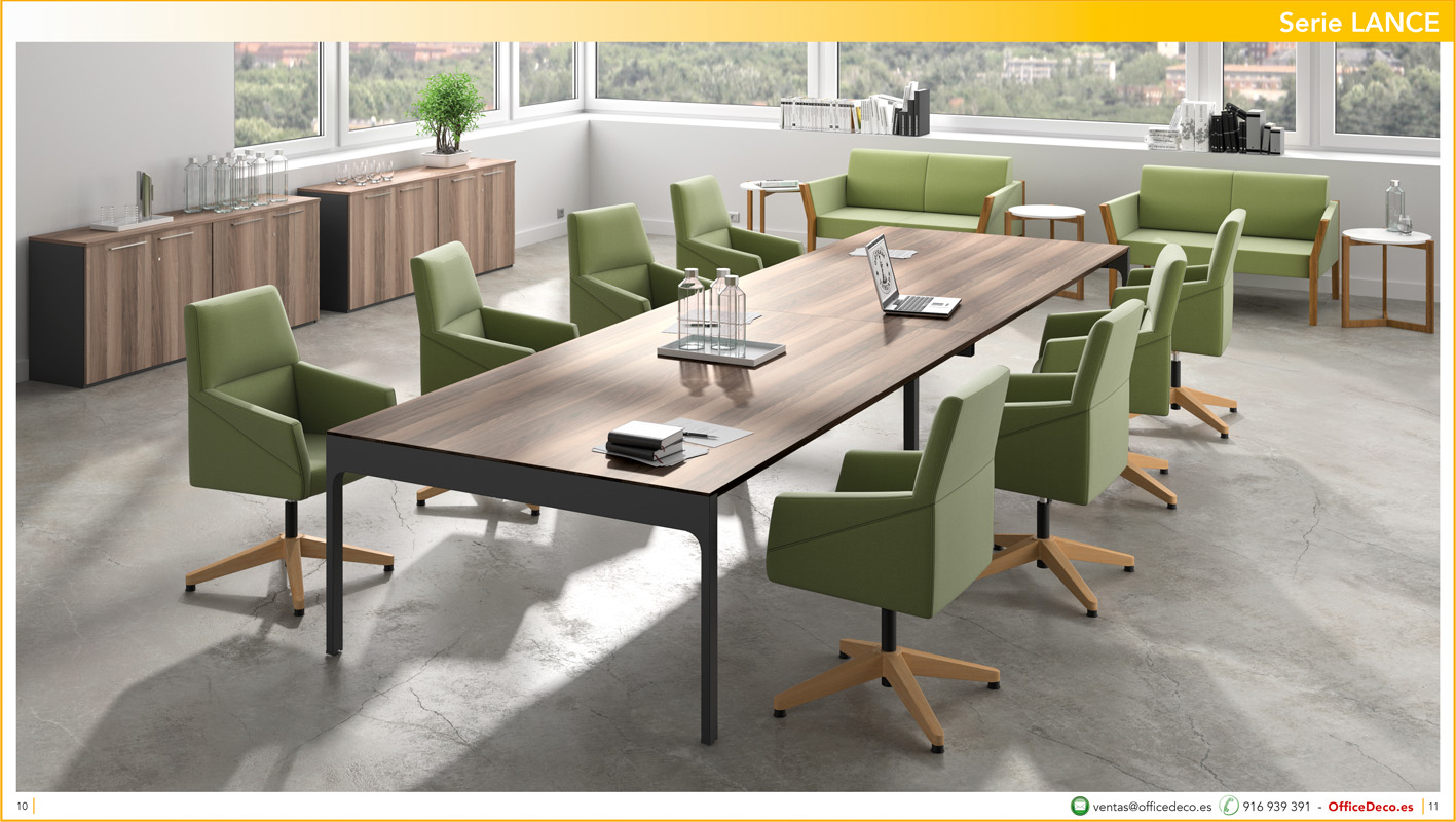 direccionlance5 | OfficeDeco Modern conference room with a long wooden table surrounded by green swivel chairs and a seating area by the windows.